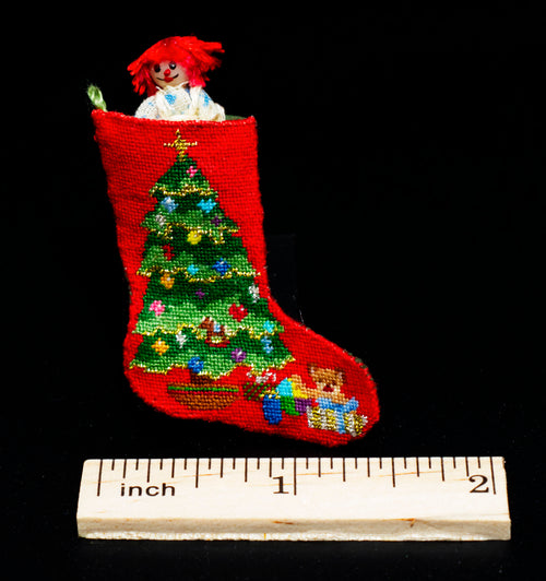 Miniature petit point Christmas stocking with a Christmas tree design and green backing